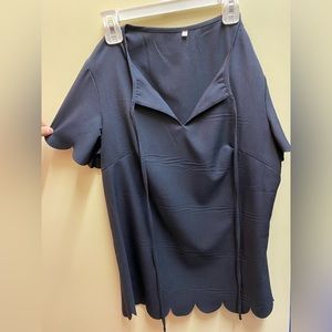 Black top with cloud-cut sleeves